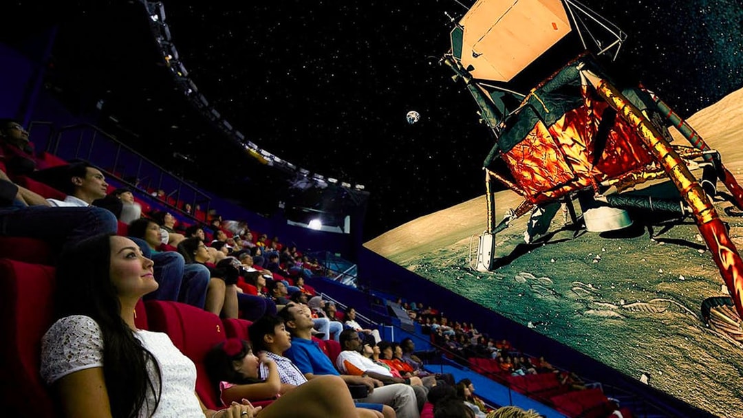 Visitors watching a space-themed show at Science Centre Singapore's planetarium.