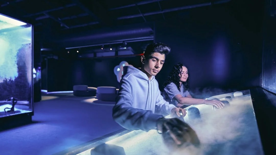 Visitors engaging with interactive exhibits at Scienceworks.