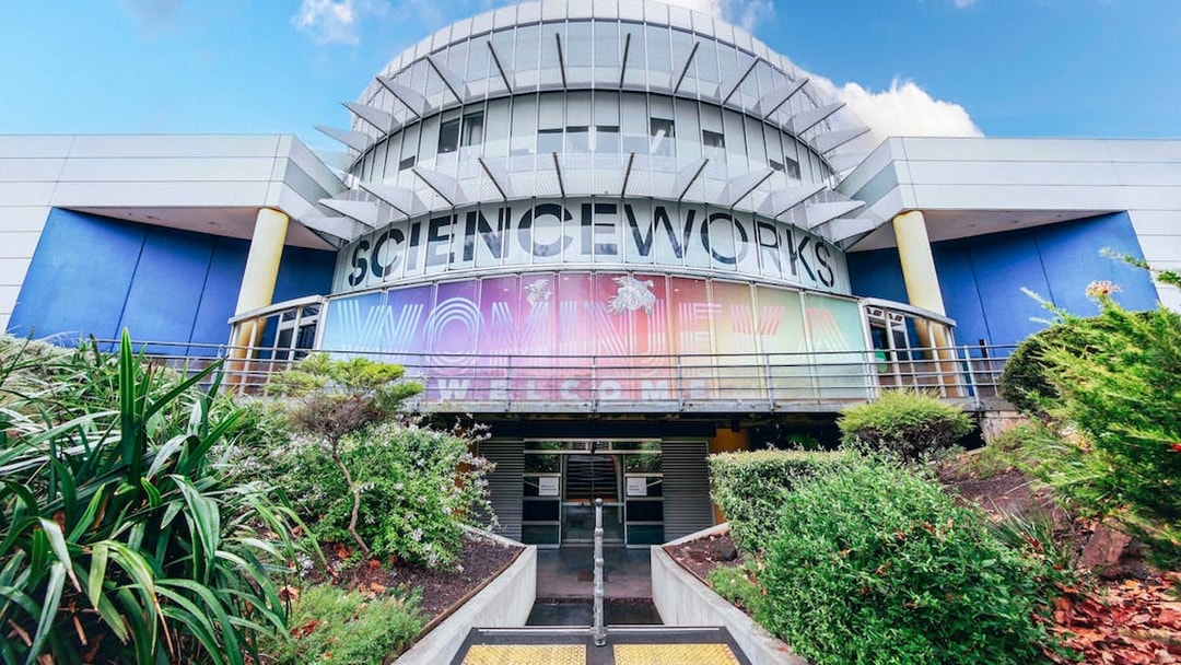 Exterior of Scienceworks museum with colorful entrance signage during daytime.