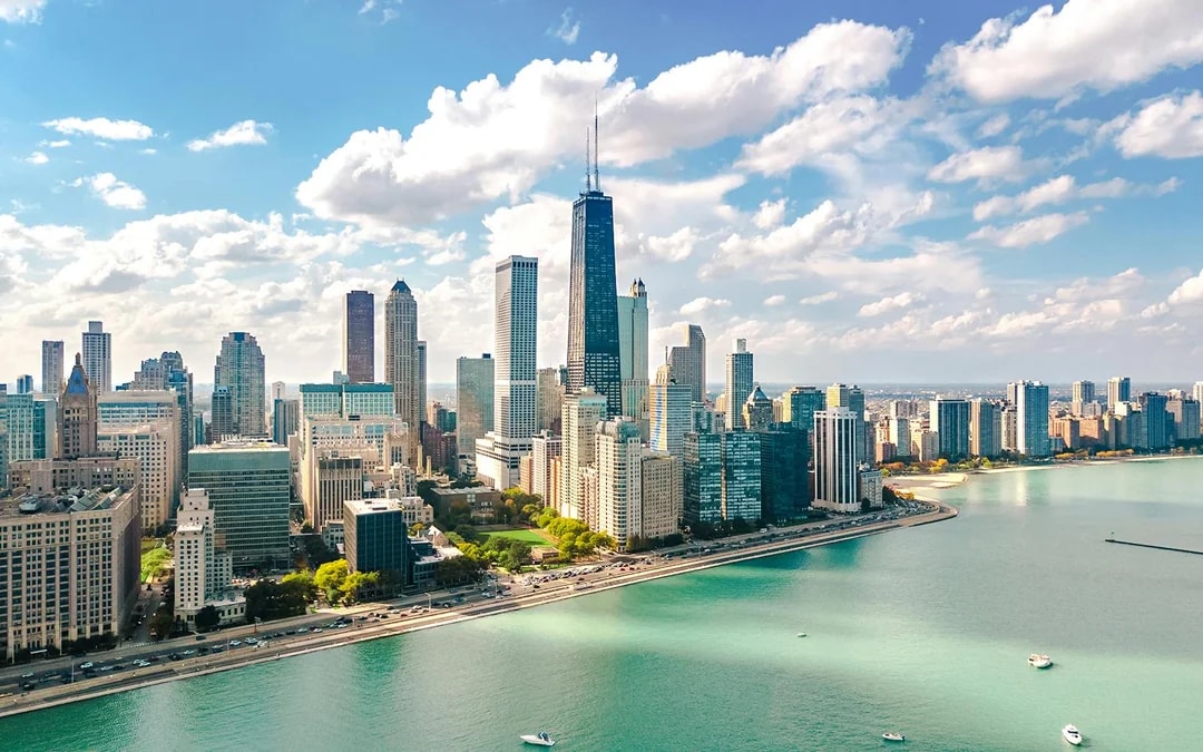 Chicago skyline aerial view with skyscrapers and Lake Michigan.