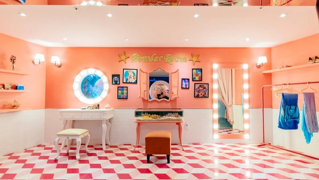 Powder room at SEA LIFE Busan Aquarium with vanity, mirror, and colorful decor.