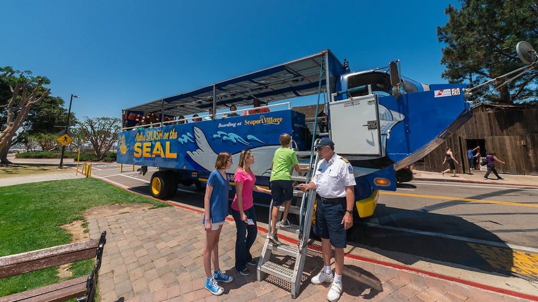 Visitors boarding the San Diego SEAL Tour vehicle at Seaport Village.
