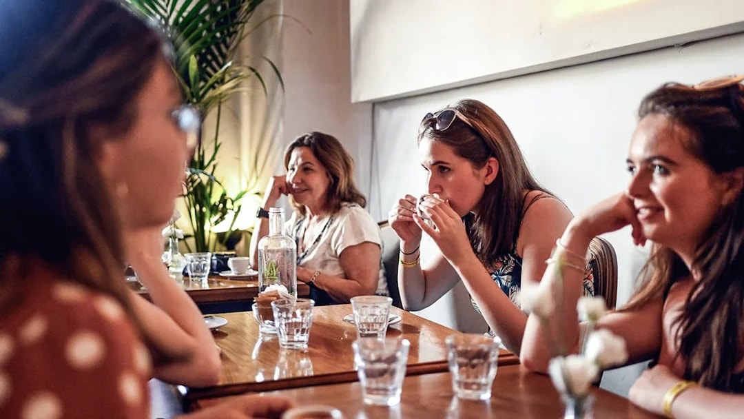 People enjoying a meal at a restaurant during a Rome food tour.