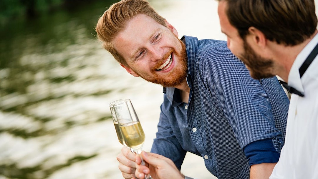Two people enjoying champagne on the Bateaux Mouches Seine River dinner cruise.