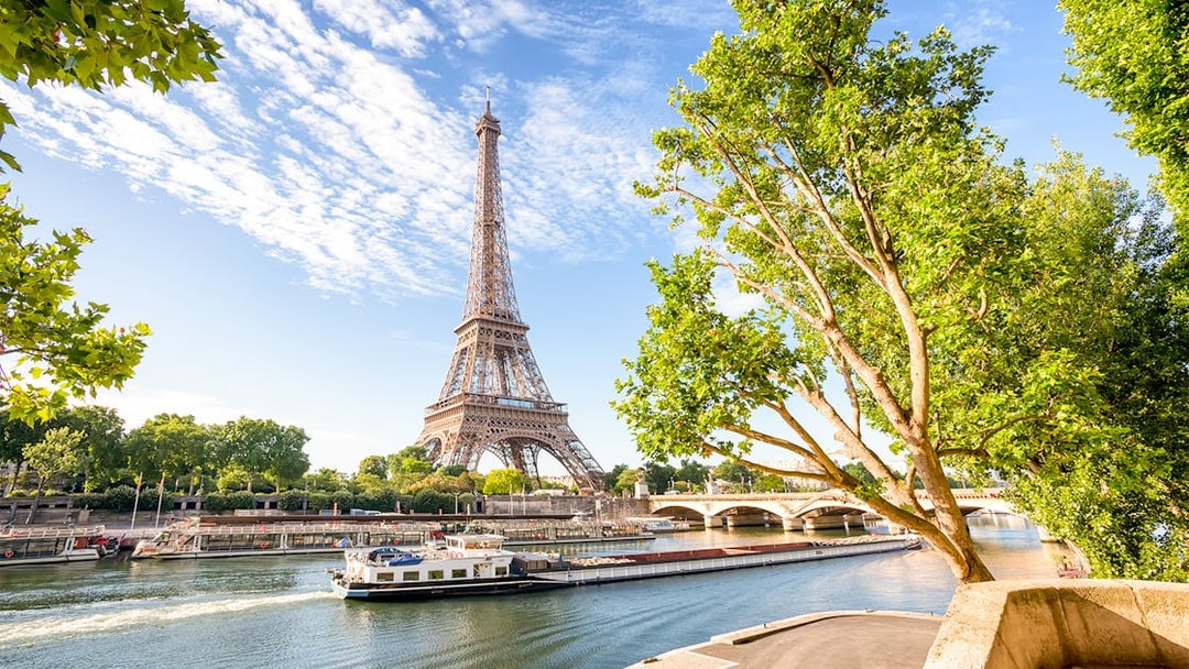 Seine river cruise with Eiffel Tower view in Paris.