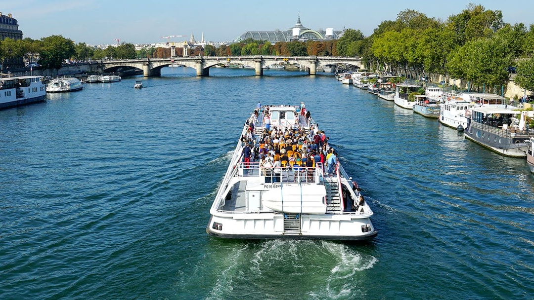 Sightseeing cruise boat on the Seine River near Canal St Martin, Paris.
