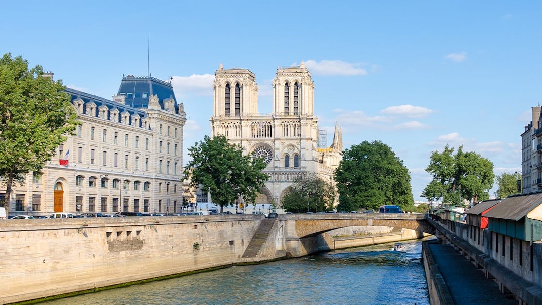 Seine River view with Notre-Dame Cathedral in Paris during morning cruise.