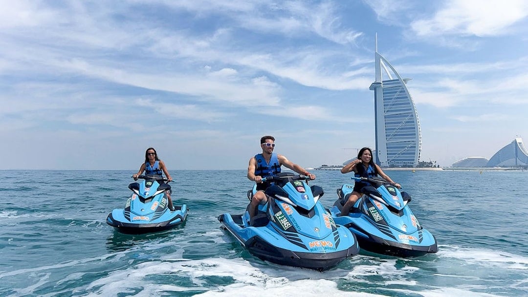Group jetskiing near Burj Al Arab, Dubai.