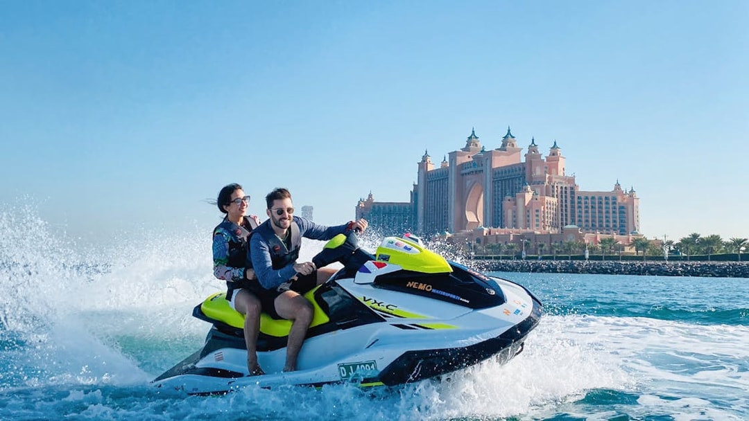 Couple jet skiing near Atlantis, The Palm in Dubai.