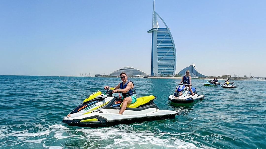 Tourists jet skiing near Burj Al Arab in Dubai.