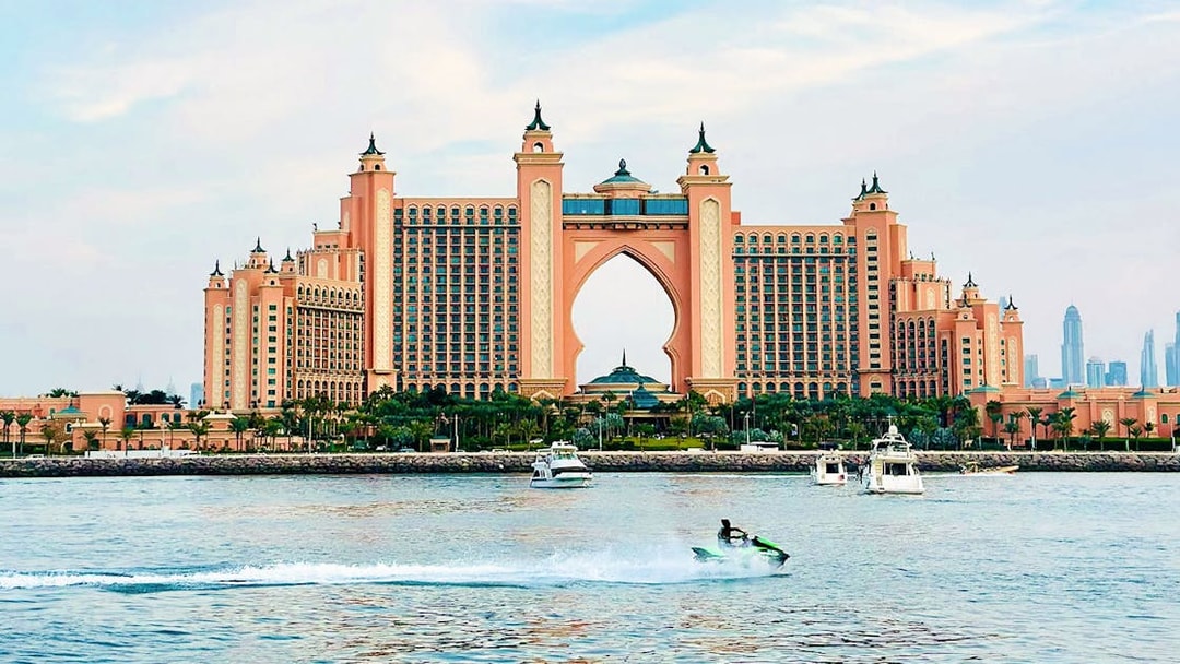 Tourist on jet ski near Atlantis, The Palm in Dubai.