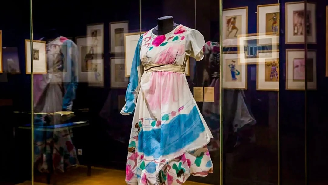 Colorful costume display at Opéra Garnier exhibit in Paris.