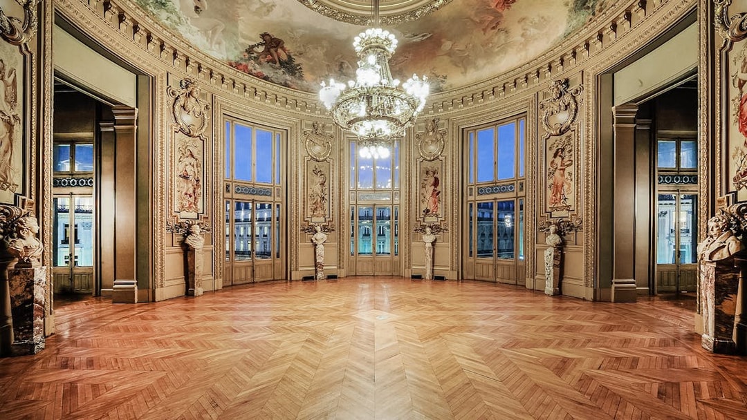 Opéra Garnier interior with ornate ceiling and chandelier, Paris.