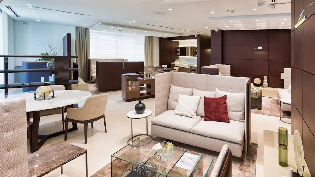 Luxurious lounge area at Serravalle Designer Outlet with modern seating and decor.