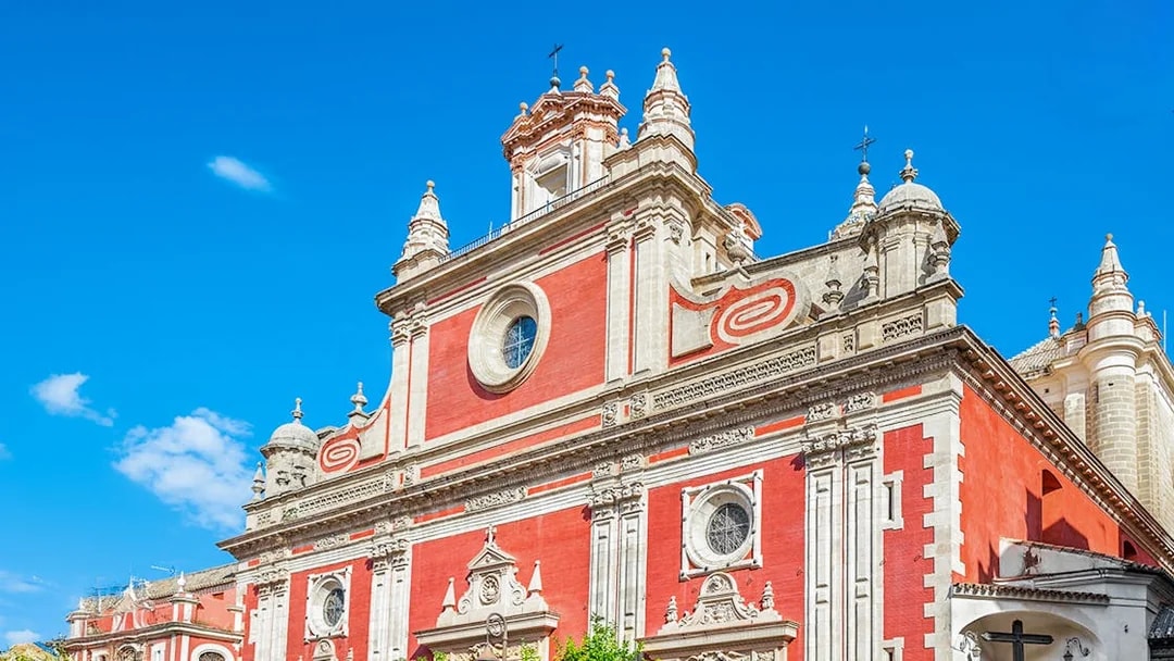 Church of El Salvador facade in Seville with ornate architectural details.