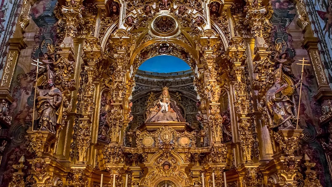 Elaborate gold altar details in El Salvador church, Seville, Andalusia, Spain.