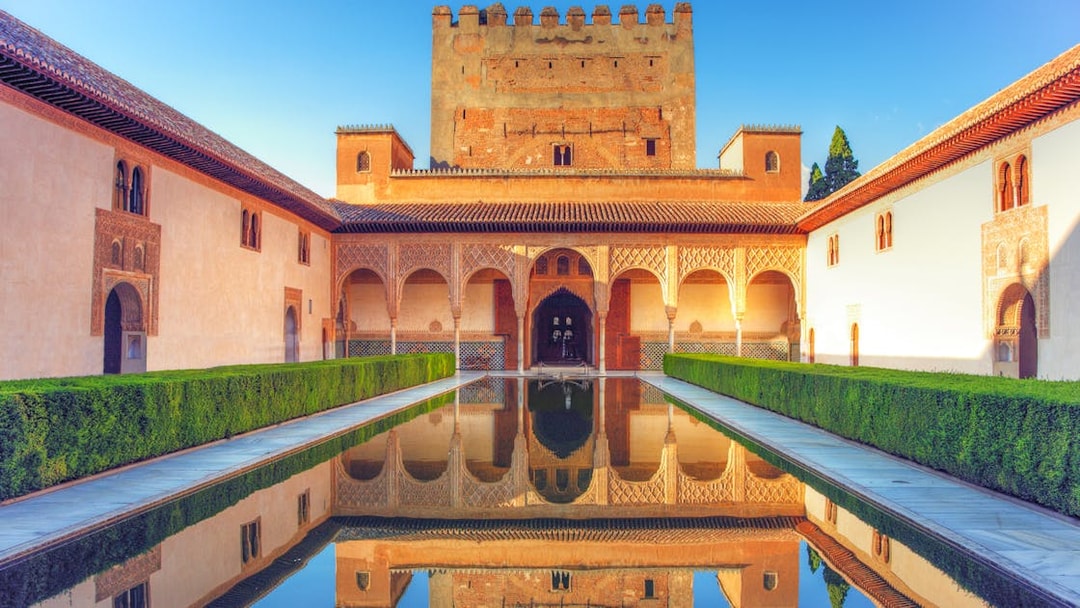 Alhambra's reflecting pool and Moorish architecture in Granada, Spain.