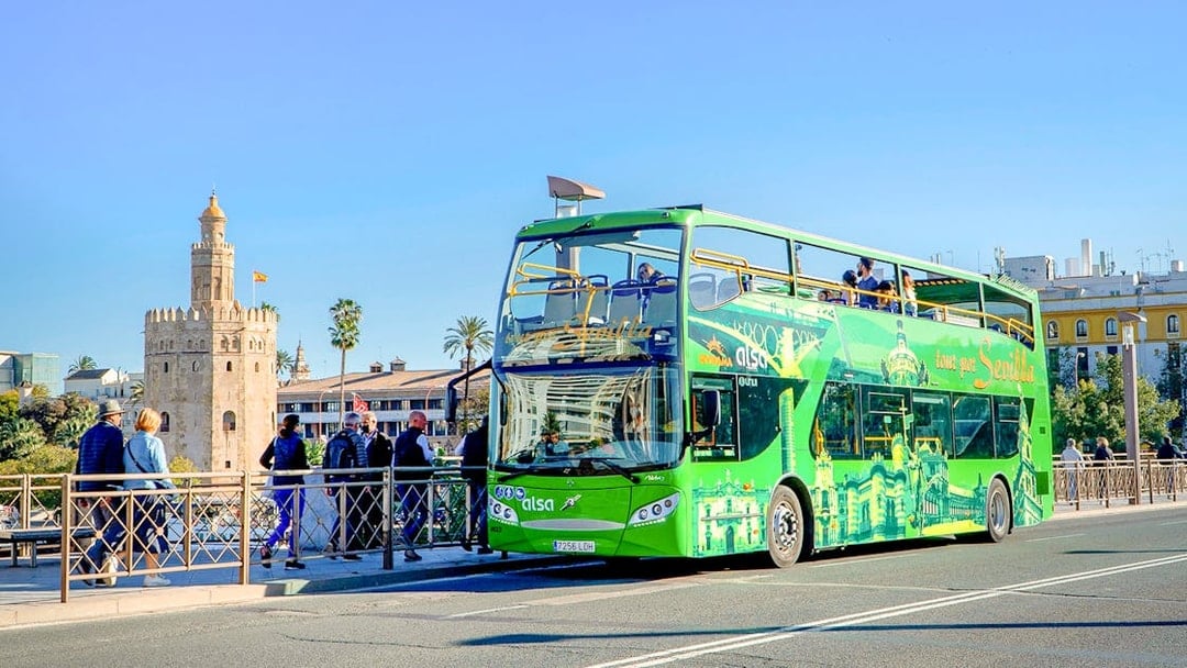 Hop-on hop-off bus near Torre del Oro, Seville.
