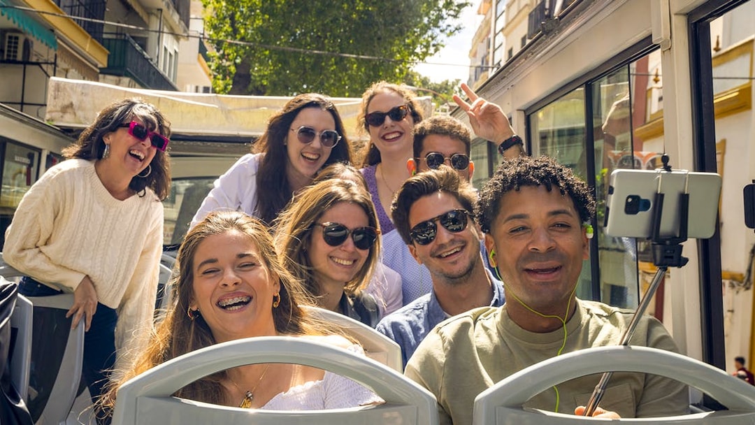 Group enjoying Sevirama Seville Hop-on Hop-off Bus Tour.