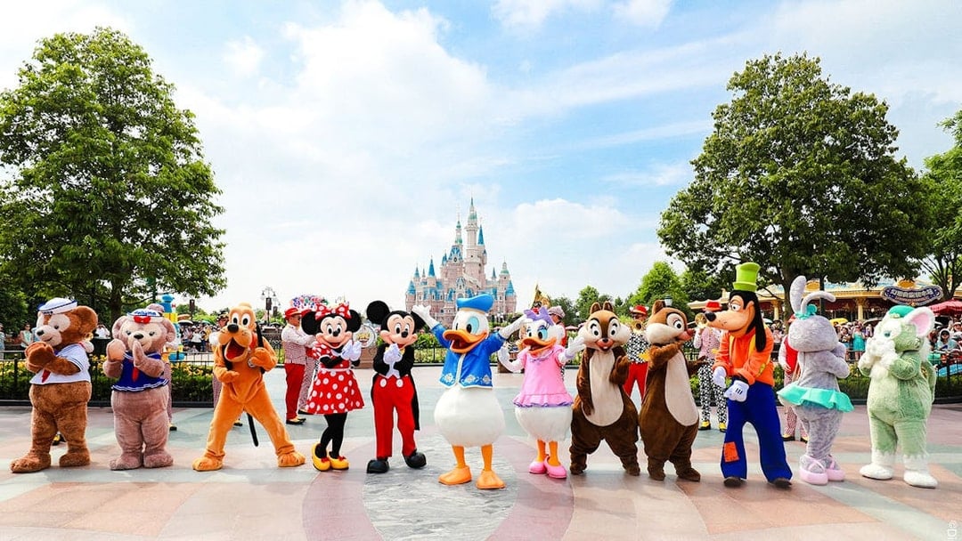 Characters in front of Enchanted Storybook Castle at Shanghai Disneyland.