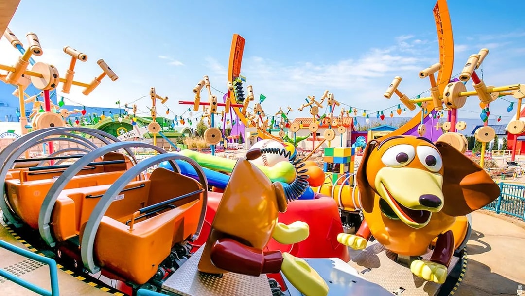 Slinky Dog ride at Shanghai Disney's Toy Story Land with colorful decorations.