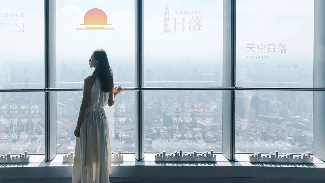 Viewing platform at Shanghai Tower overlooking cityscape.