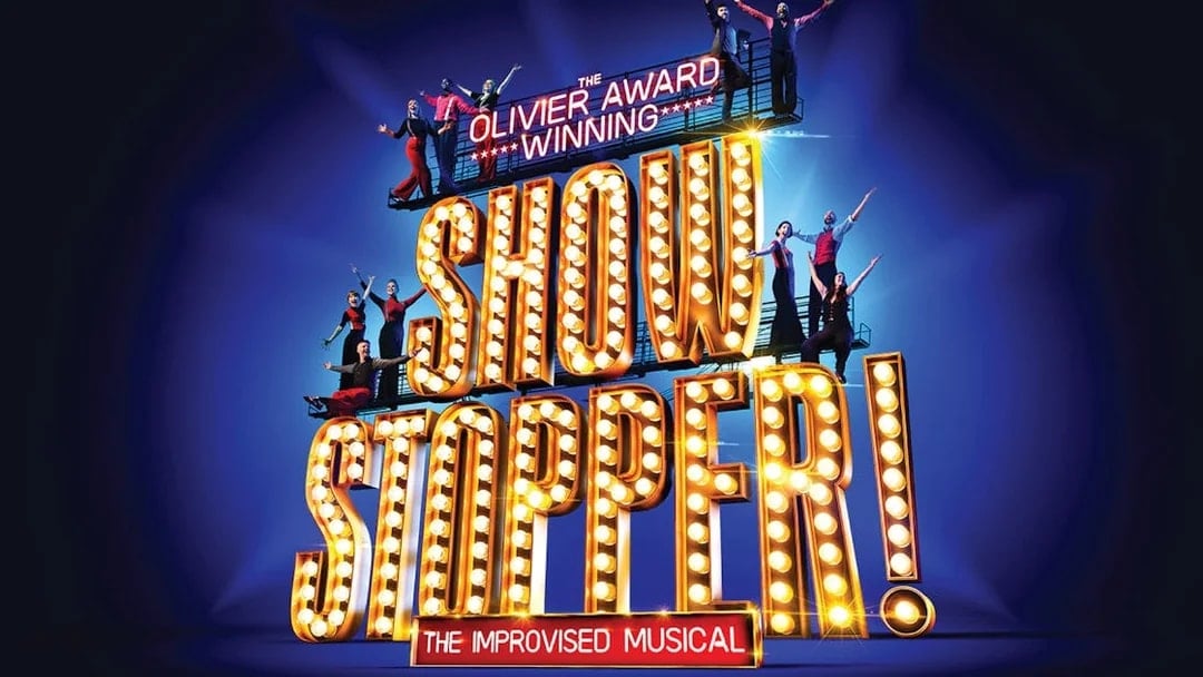 Showstopper! The Improvised Musical sign with performers on stage.
