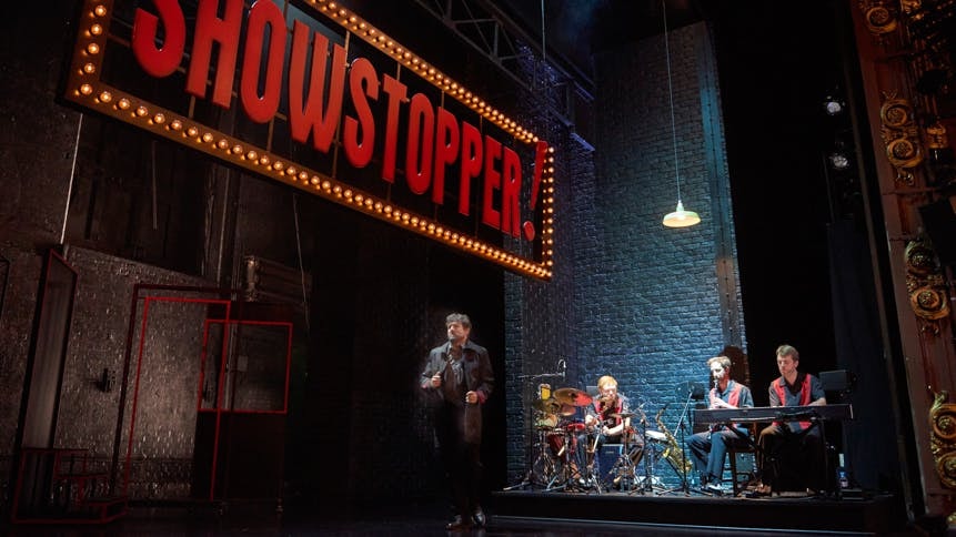 Showstopper! The Improvised Musical performance with musicians on stage.