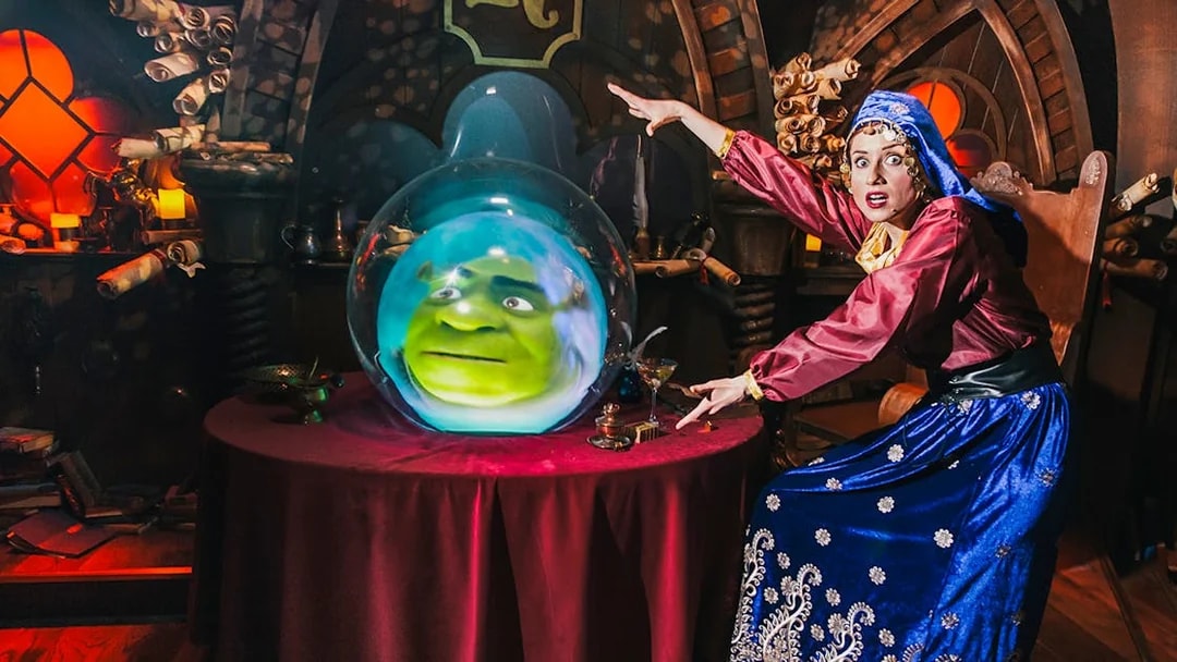 Fortune teller with Shrek's face in a crystal ball at Shrek’s Adventure! London.