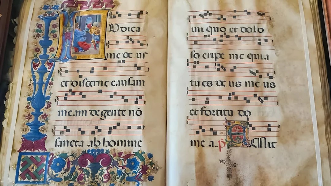 Illuminated manuscript with musical notation at Siena Duomo Complex.