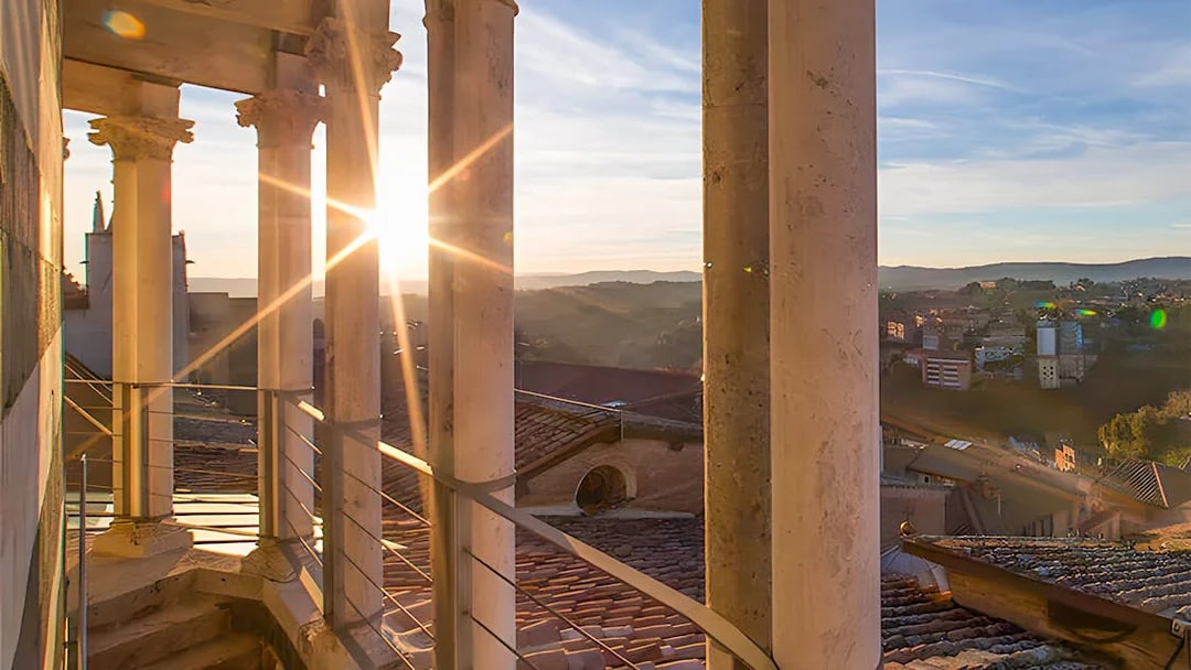 Sunset view through columns at Siena Duomo Complex, Italy.