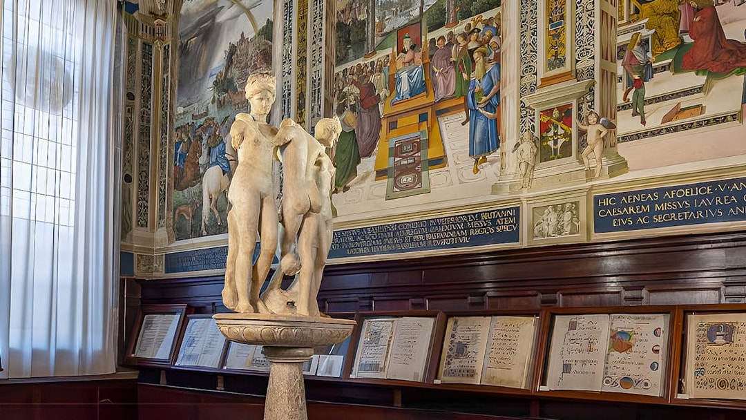 Sculpture and frescoes inside Siena Cathedral library, Italy.
