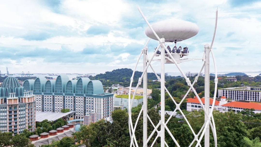Singapore skyline view from cable car ride with Sentosa Island attractions.