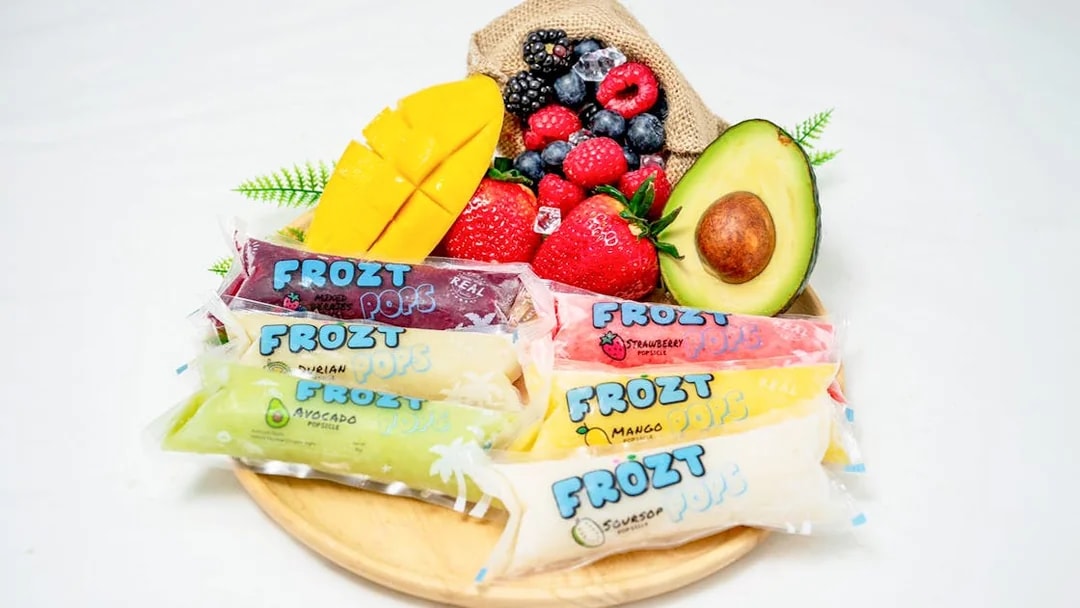 Frozt popsicles with assorted fruits on a wooden plate, Singapore Cable Car Sky Pass.