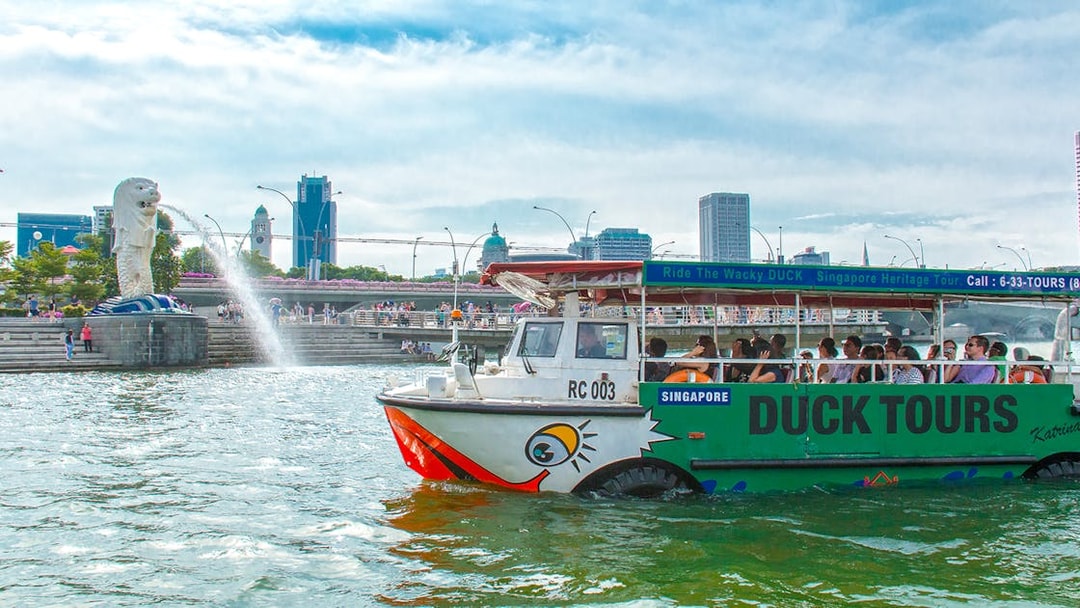 DUCKtour boat on Singapore River near Merlion Fountain.
