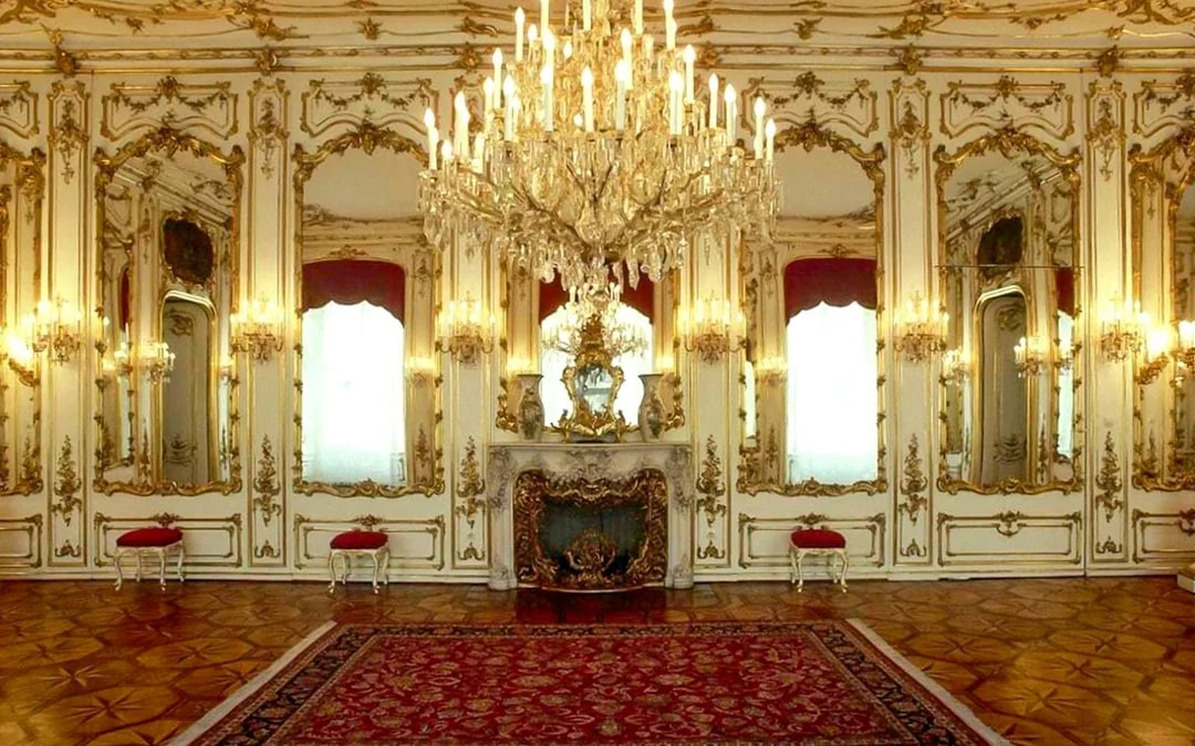 Imperial apartments with ornate chandeliers and mirrors in Sisi Museum.