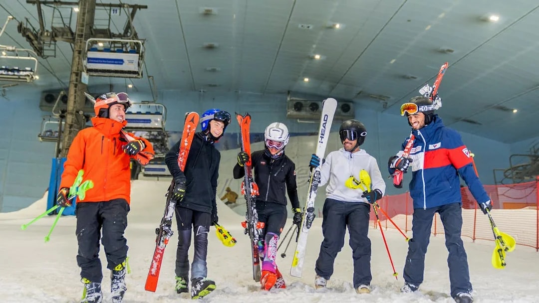 Group skiing at Ski Dubai indoor slope.