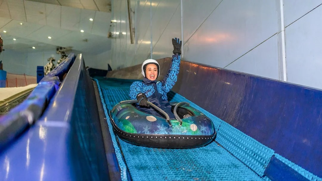 Guest enjoying the 'Mountain Thriller' ride at Ski Dubai.