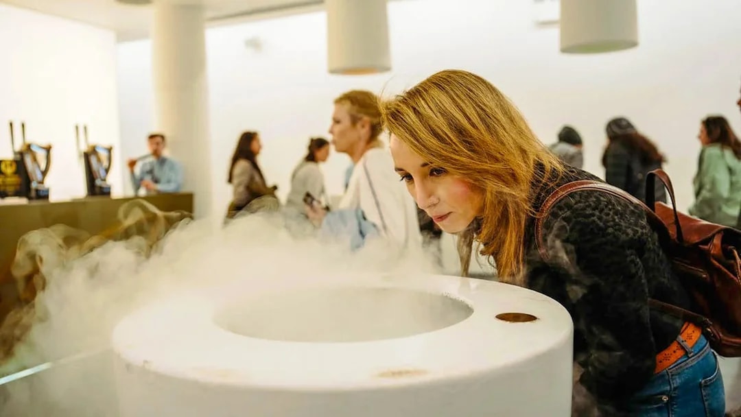 Visitor engaging with mist exhibit at Storehouse interactive display.