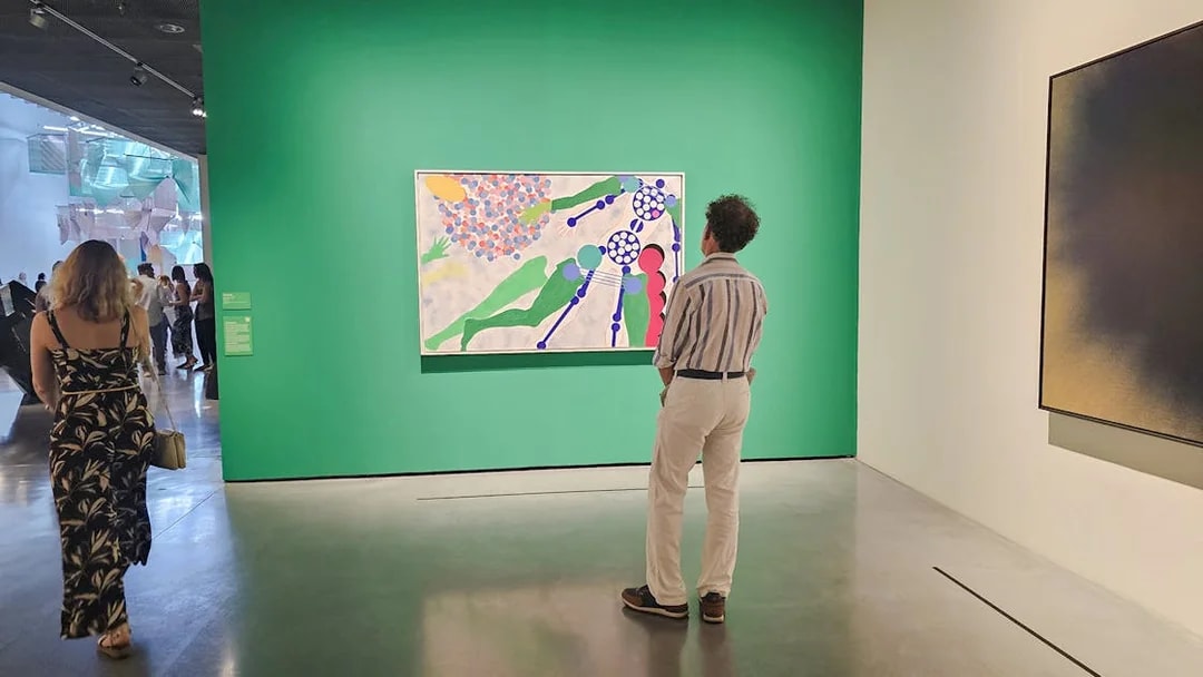 Visitors viewing modern art at Centre Pompidou Malaga exhibition interior.