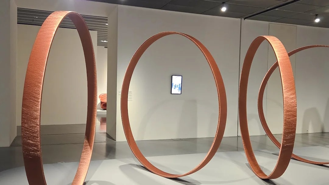 Large circular sculptures in Centre Pompidou Malaga exhibition interior.