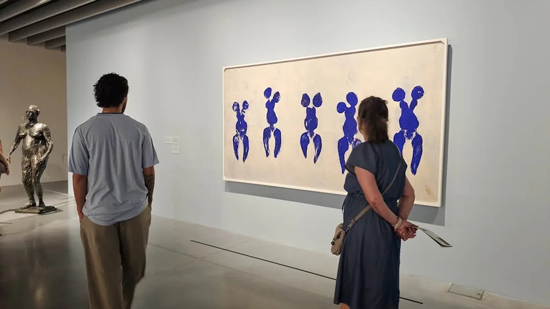 Visitors viewing artwork at Centre Pompidou Malaga exhibition interior.