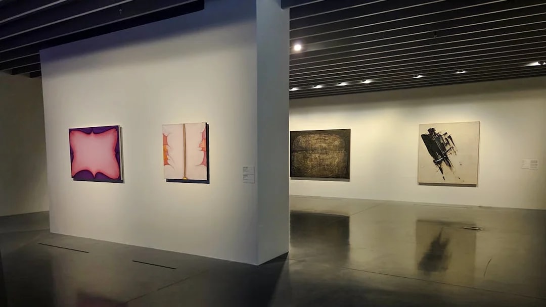 Centre Pompidou Malaga exhibition interior with abstract paintings on display.