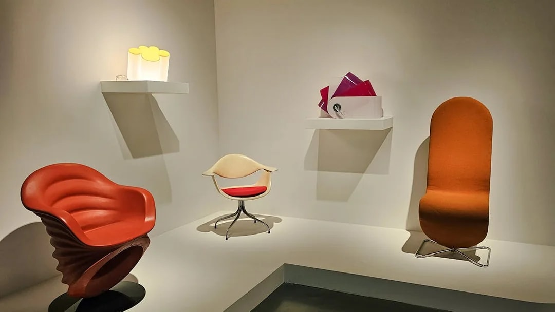 Centre Pompidou Malaga exhibition interior with modern chairs and art displays.