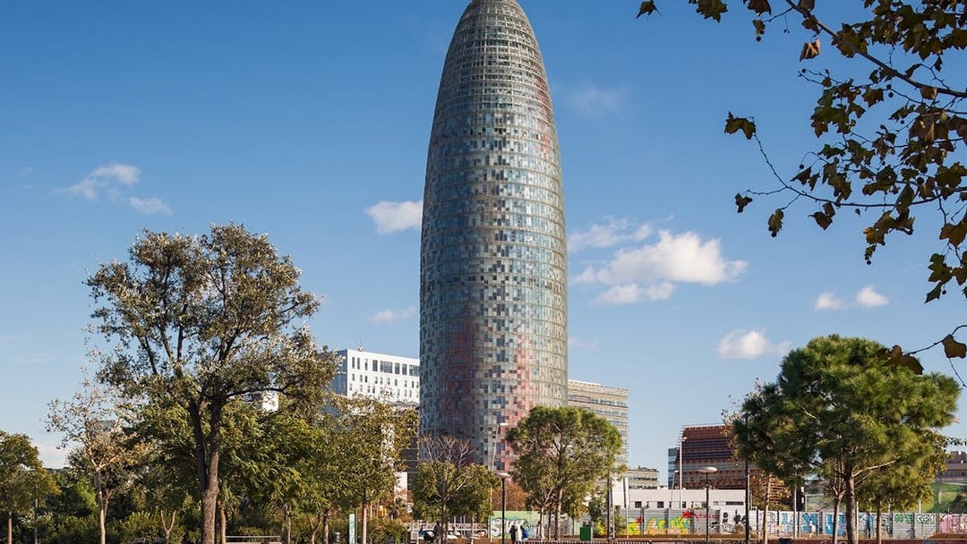 Glories Skyline Tower in Barcelona with surrounding park and trees.