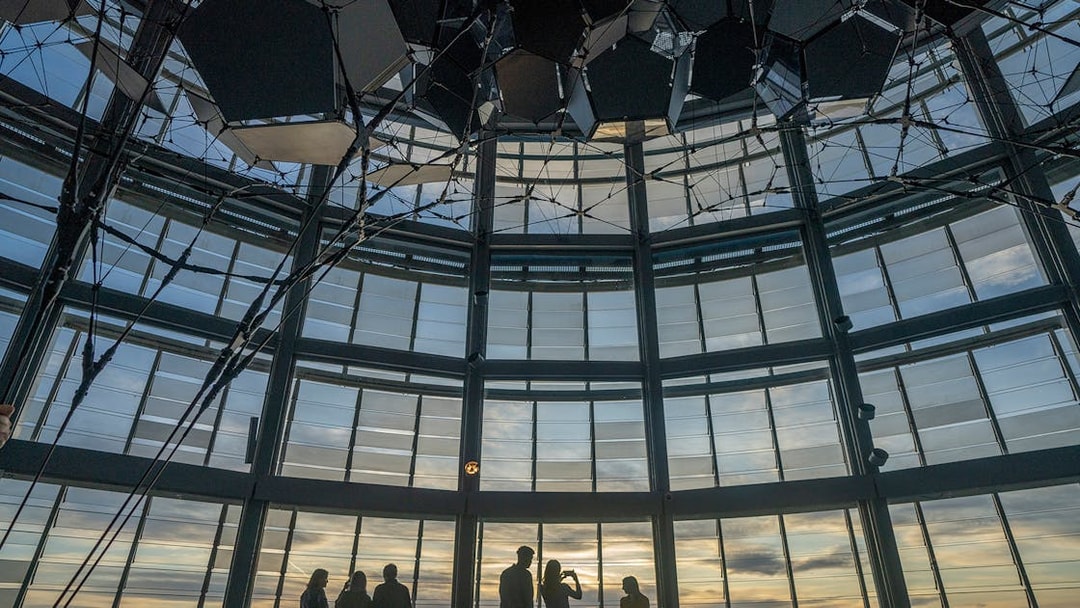 Visitors enjoying sunset views from Torre Glories Lookout in Barcelona.