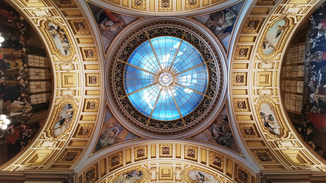 Ceiling dome with intricate frescoes at the National Prague Museum.