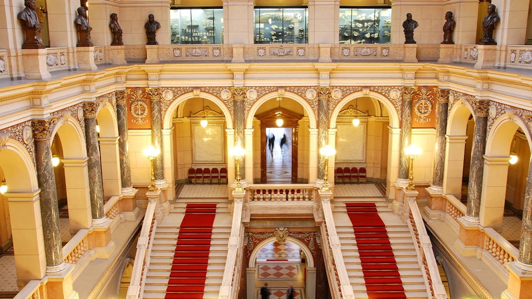 Grand staircase and ornate arches inside the National Prague Museum.