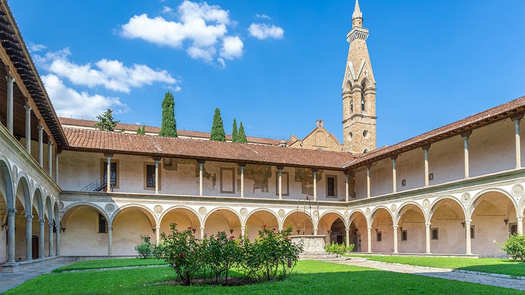 Cloisters of Santa Croce Basilica Complex with arches and central garden in Florence.