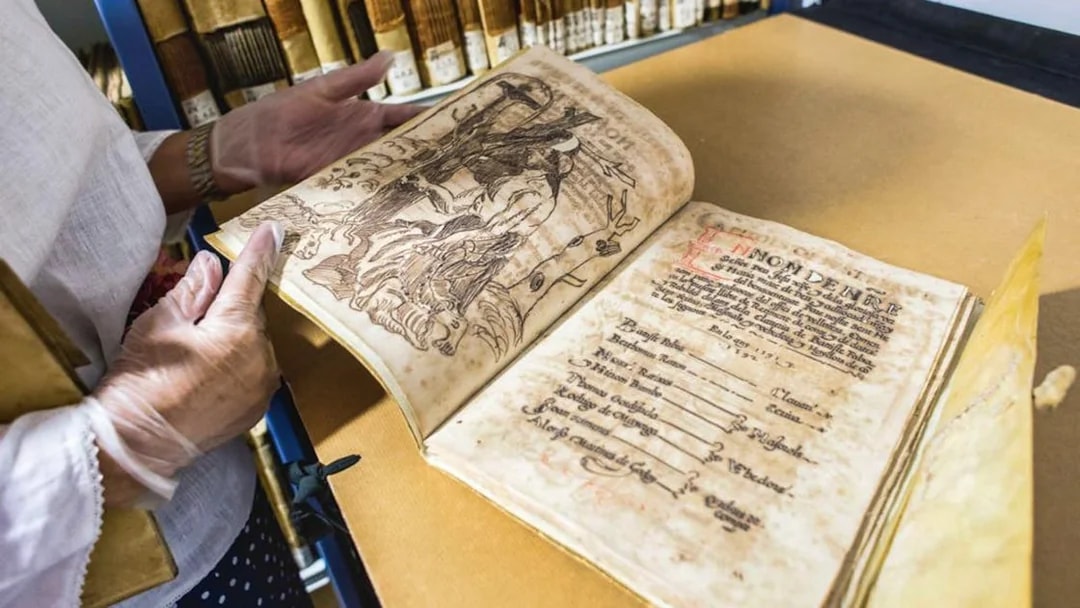 Old manuscript being examined at Silk Museum Valencia.